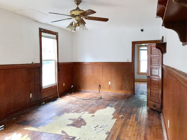 Before photo of living room in historic beach duplex in Cape Charles Virginia