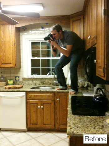 Before Photo Of Kitchen With John Standing On Granite Counters