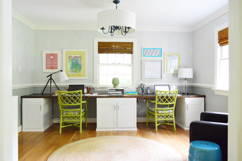 Finished Colorful Office Space With Green Chairs and Built In Wall To Wall Desk