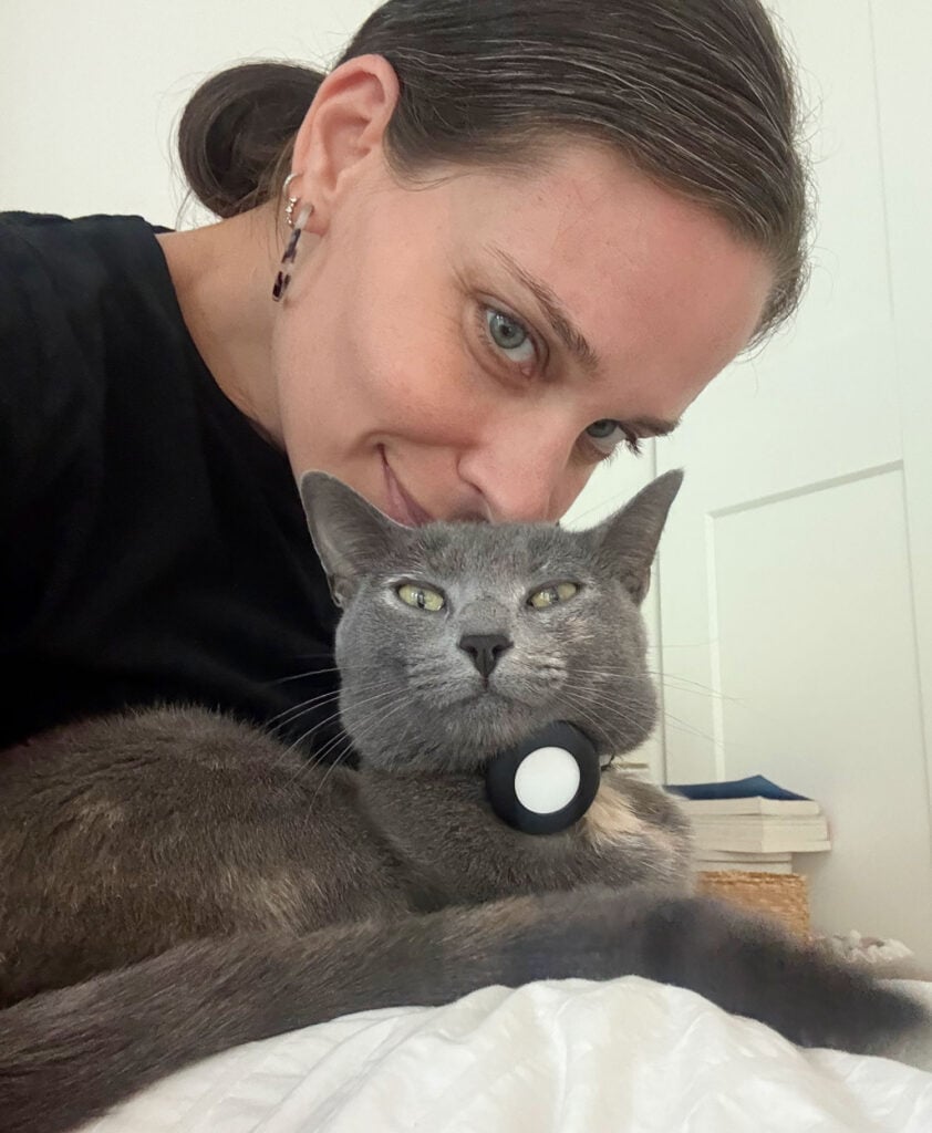 Sherry putting face on head of cat