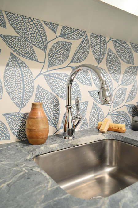 Detail Of Leafy Wallpaper Backsplash In Modern Laundry Room