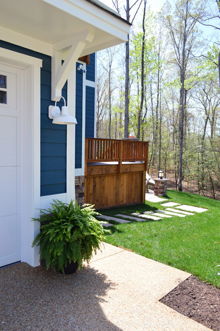 Outdoor Area By Garage With Walkway To Backyard Of Show House