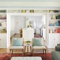 Built-In Bookshelf Around Doorway Painted Benjamin Moore Simply White