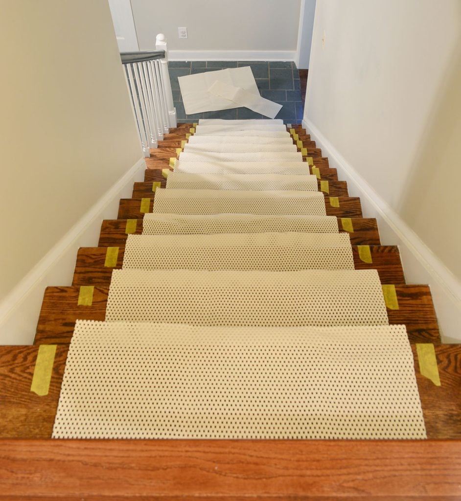 Overhead view of stairs with runner with rug pad